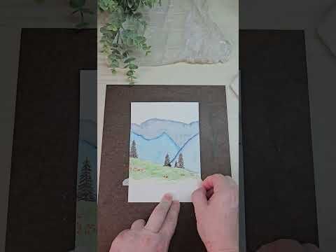A watercolor painting of a mountain landscape with trees, depicting a creative output that could be shared in niche art subreddits.